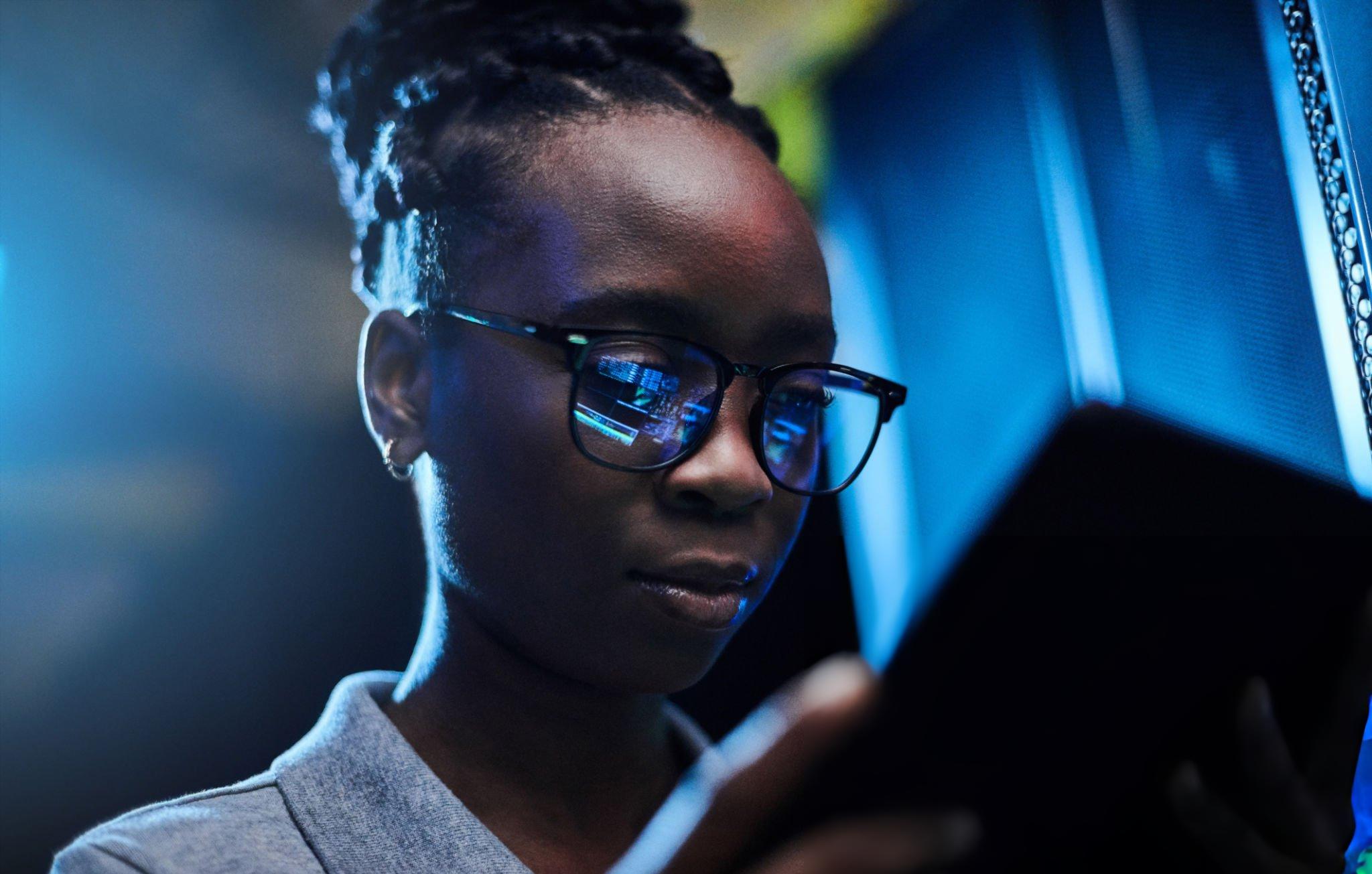 African technology professional working at a computer